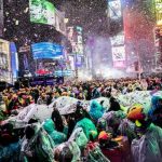 Times Square New Year's Eve Revelers Brave the Rain Without Umbrellas for Iconic Ball Drop