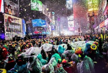 Times Square New Year's Eve Revelers Brave the Rain Without Umbrellas for Iconic Ball Drop