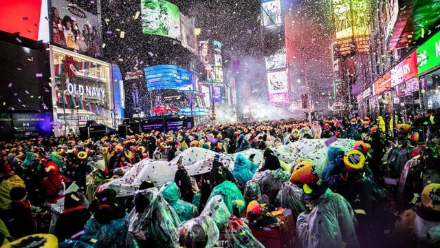 Times Square New Year's Eve Revelers Brave the Rain Without Umbrellas for Iconic Ball Drop